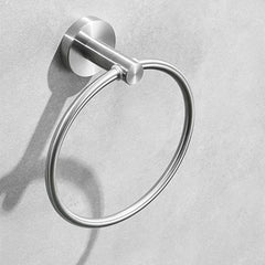 Brushed silver stainless steel towel ring mounted on a wall.