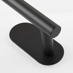 Matte black 304 stainless steel adhesive toilet paper holder with oval base.
