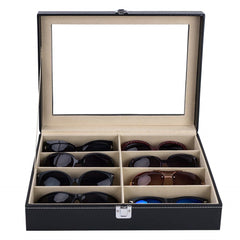 Black PU leather sunglasses case with 8 slots and clear acrylic lid, open to display various pairs.