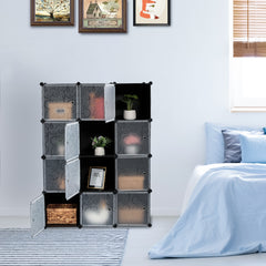 White and black 12-cube closet organizer with doors in a bedroom setting.