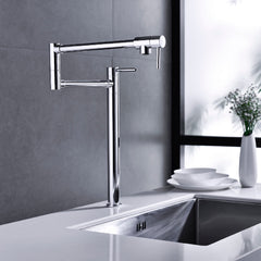 Brushed nickel two-handle brass pot filler faucet mounted on kitchen wall above sink.