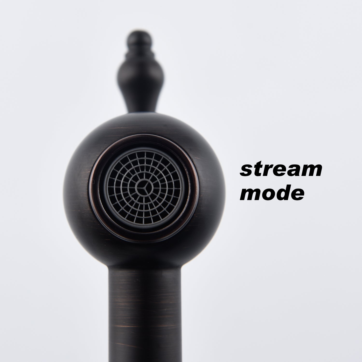 Matte black brass wall-mount pot filler faucet in stream mode with ornate handle.