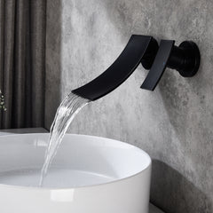 Matte black wall-mount bathroom waterfall faucet pouring water into a white sink.