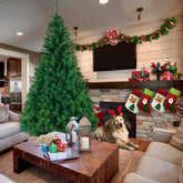 A 5.5-foot green PVC artificial Christmas tree with 850 branches in a cozy living room.