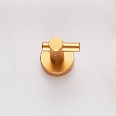 Brushed gold wall mount hook made of heavy duty aluminum, shown from above.