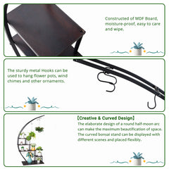 A black iron semicircle plant stand with five tiers of dark wood shelves.