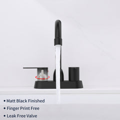 Matte black 2-handle centerset bathroom faucet with water flow.