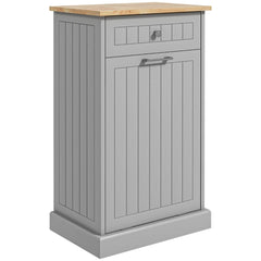 Gray kitchen cabinet with tilt-out trash bin, drawer, and wooden top.