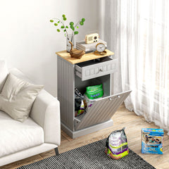 Gray kitchen tilt-out trash bin cabinet with drawer, shown open with bins inside.