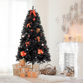 A 7ft black PVC Christmas tree with 1500 branches on an iron stand, decorated with red bows and ornaments.