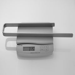 Wall-mounted gun grey aluminum towel ring on a scale showing 3.15 inches.