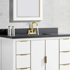 Brushed gold 2-handle centerset bathroom faucet with pop-up drain on white vanity.
