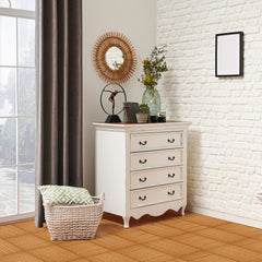 Light brown interlocking plastic deck tiles forming a tiled floor in a bright room corner.
