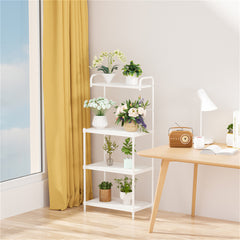 A white 4-tier metal storage shelf holds various potted plants and flowers in a room.
