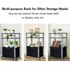 A black multi-purpose rack with three shelves and a two-door cabinet, shown with plants, books, and decor.