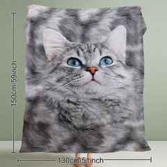 A 50x60-inch black-and-white fleece throw blanket featuring a close-up print of a cute gray tabby kitten with blue eyes.