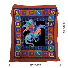 A flannel throw blanket with a colorful dragon design in a patterned border.