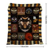 A 50x60 inch flannel velvet throw blanket with black, orange, and gold bee and floral patterns.