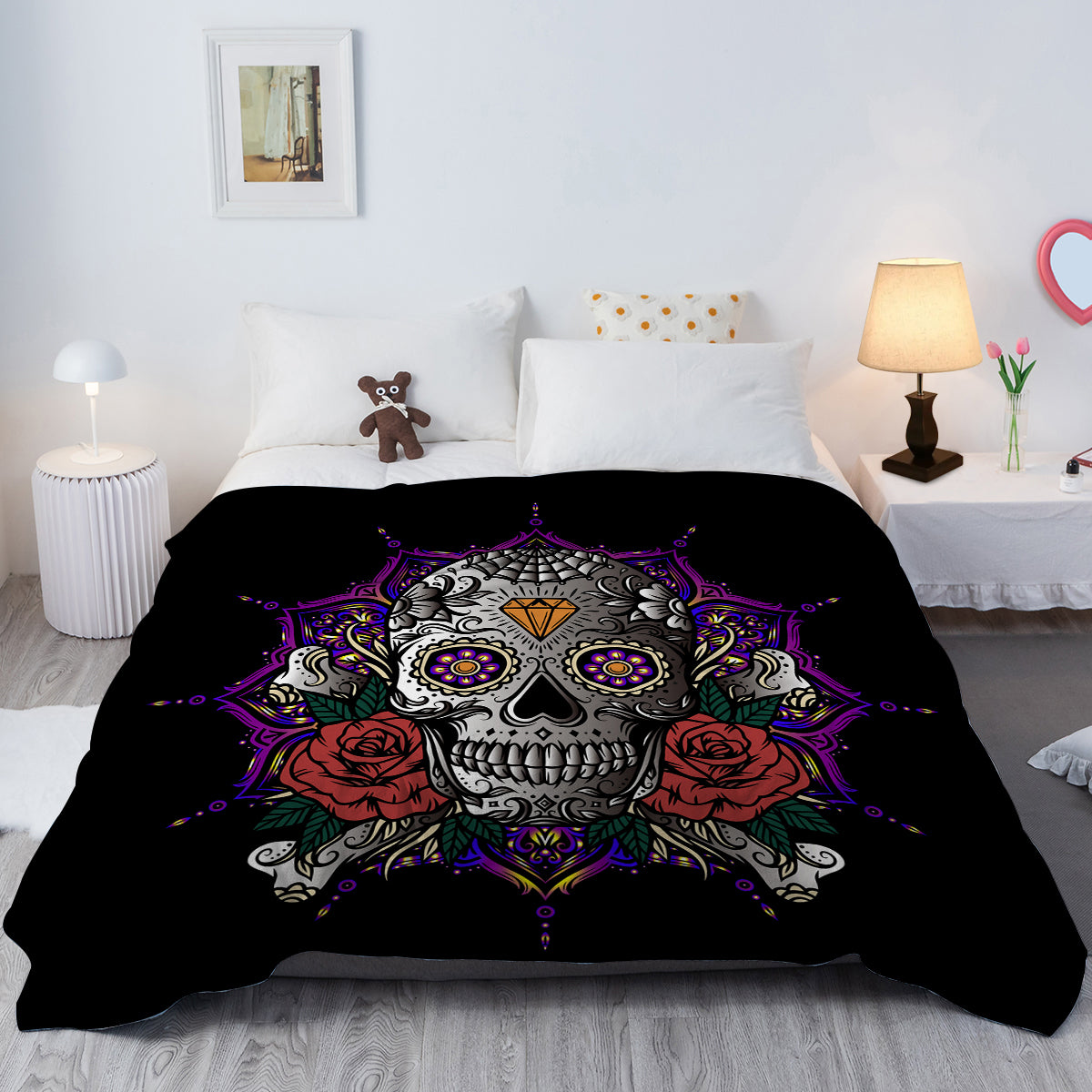 A black flannel throw blanket featuring a colorful sugar skull and red roses design.