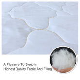 White queen comforter with black and gold geometric cube pattern, reversible, and two shams.