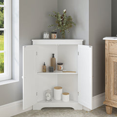White freestanding corner cabinet with open beadboard doors, adjustable shelves, and decorative items inside.