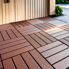 Dark brown plastic interlocking deck tiles are arranged in a checkerboard pattern.