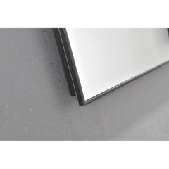 A 32x24 inch rectangular LED backlit bathroom mirror with black frame on a gray surface.