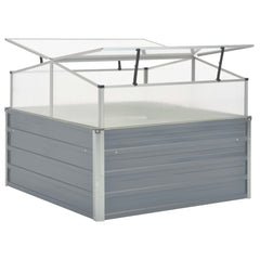 Gray galvanized steel greenhouse with transparent panels and prop-open roof ventilation.