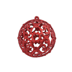 Red plastic Christmas ball ornament with intricate filigree pattern and hanging loop.