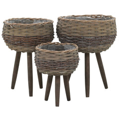 Three brown wicker planters in graduated sizes on wooden legs, with PE lining.