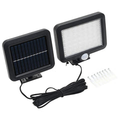 Black solar-powered LED floodlight with motion sensor, white light panel, and mounting screws.