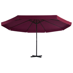 Large Bordeaux red garden parasol with 197 inch canopy and aluminum pole on cross base.