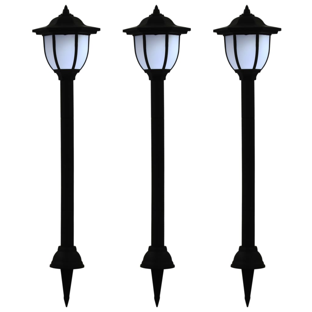 Three black LED solar garden stake lights with white lanterns and ground stakes.