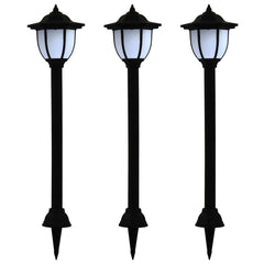 Three black LED solar garden stake lights with white lanterns and ground stakes.