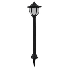 Black solar LED garden stake light with white lantern top and ground stake.
