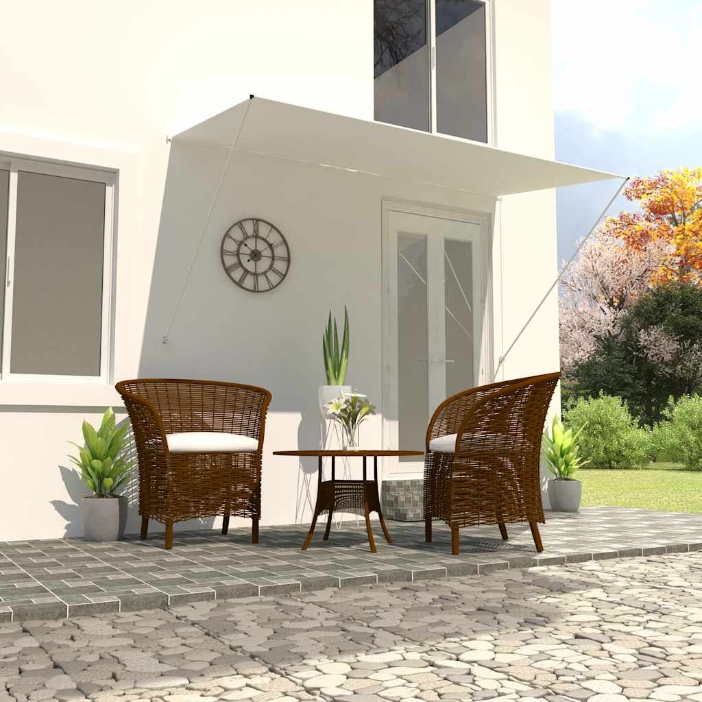 Cream retractable awning extended over patio with wicker chairs and table.