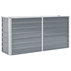 Gray galvanized steel raised garden bed measuring 63x15.7x31.3 inches with slatted sides.
