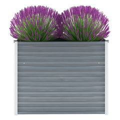 Gray galvanized steel raised garden bed with purple lavender plants.