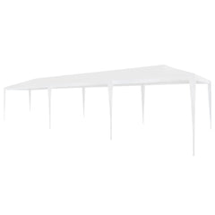 A long, white outdoor party tent with a peaked roof and multiple support poles.