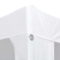 A close-up of a white polyethylene outdoor party tent corner with a metal grommet.