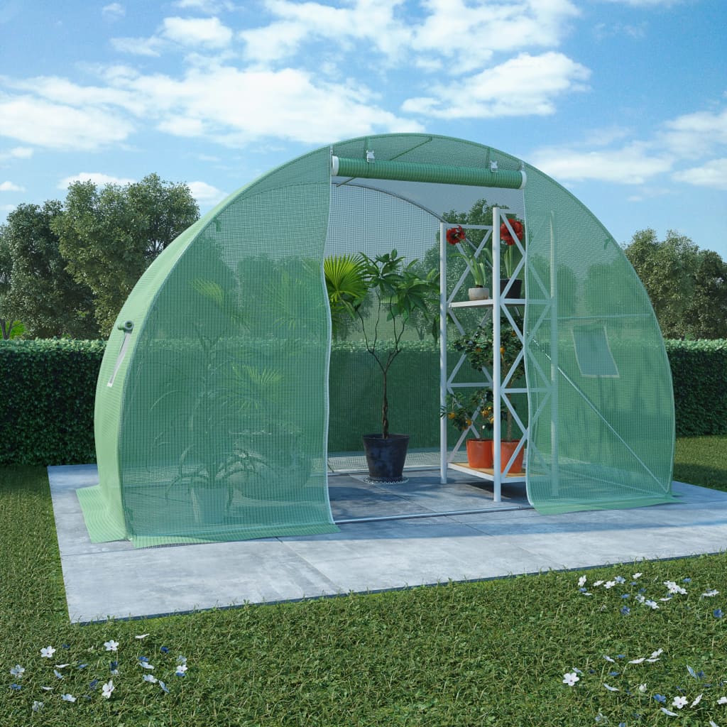 Green PE mesh greenhouse, 118x59x79 inches, with open door, windows, and plants inside on a lawn.