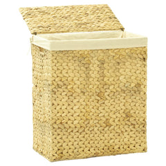 A rectangular, natural woven water hyacinth laundry basket with an open lid and a light-colored liner.