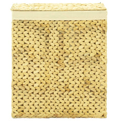 Natural woven water hyacinth laundry hamper with a light fabric liner.