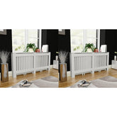 Two white MDF radiator covers, 67.7 inches wide, with slatted fronts, placed against a wall in a living room.