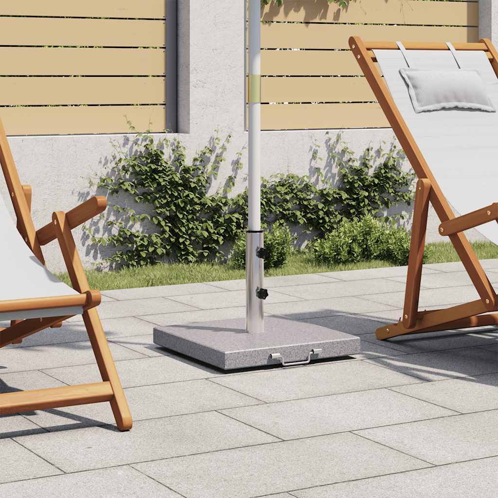 A 17.7-inch granite stainless steel parasol stand with a square base and wheels, weighing 63.9 lbs, on a patio near lounge chairs.