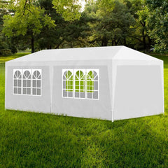 White 10'x20' party tent with steel frame, arched window panels, and zippered door on green grass.
