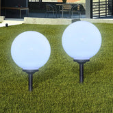 Bostome LED solar pathway lights with a 11.8" white glossy ball and ground spike for installation.