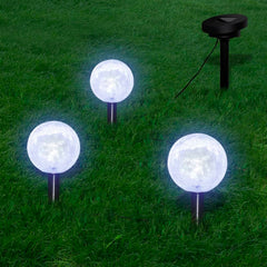 Three solar-powered LED garden bowl lights with ground spikes for easy installation.