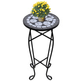 Black and white ceramic mosaic side table with a sturdy iron frame for outdoor use.