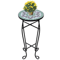 Green and white ceramic mosaic side table with curved iron legs, 23.6 inches tall.
